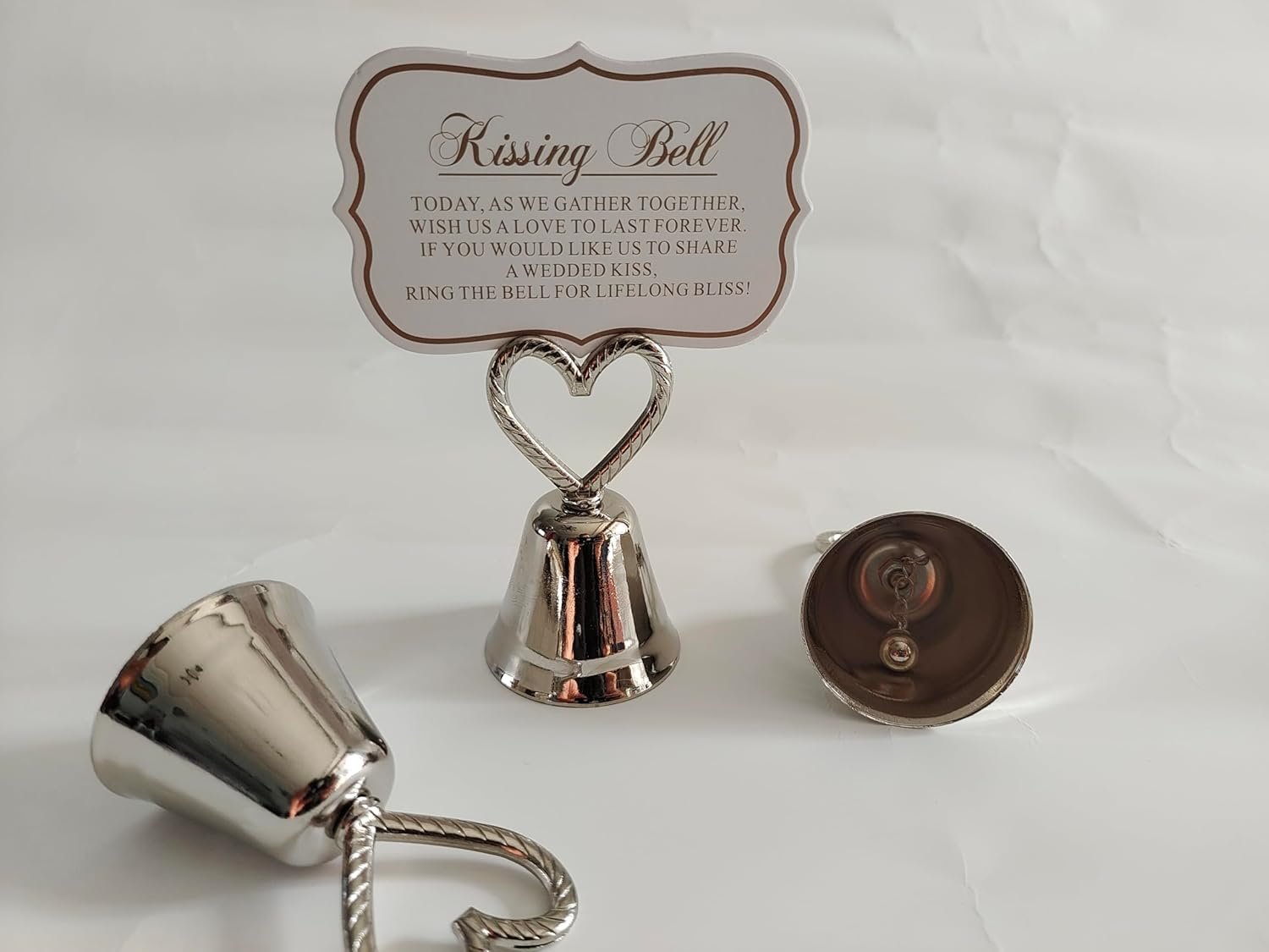 Wholesale 10Pcs Kissing Silver Bell Seat Table Card Place Number Photo Holders Party Favors Wedding Decorations Supplier