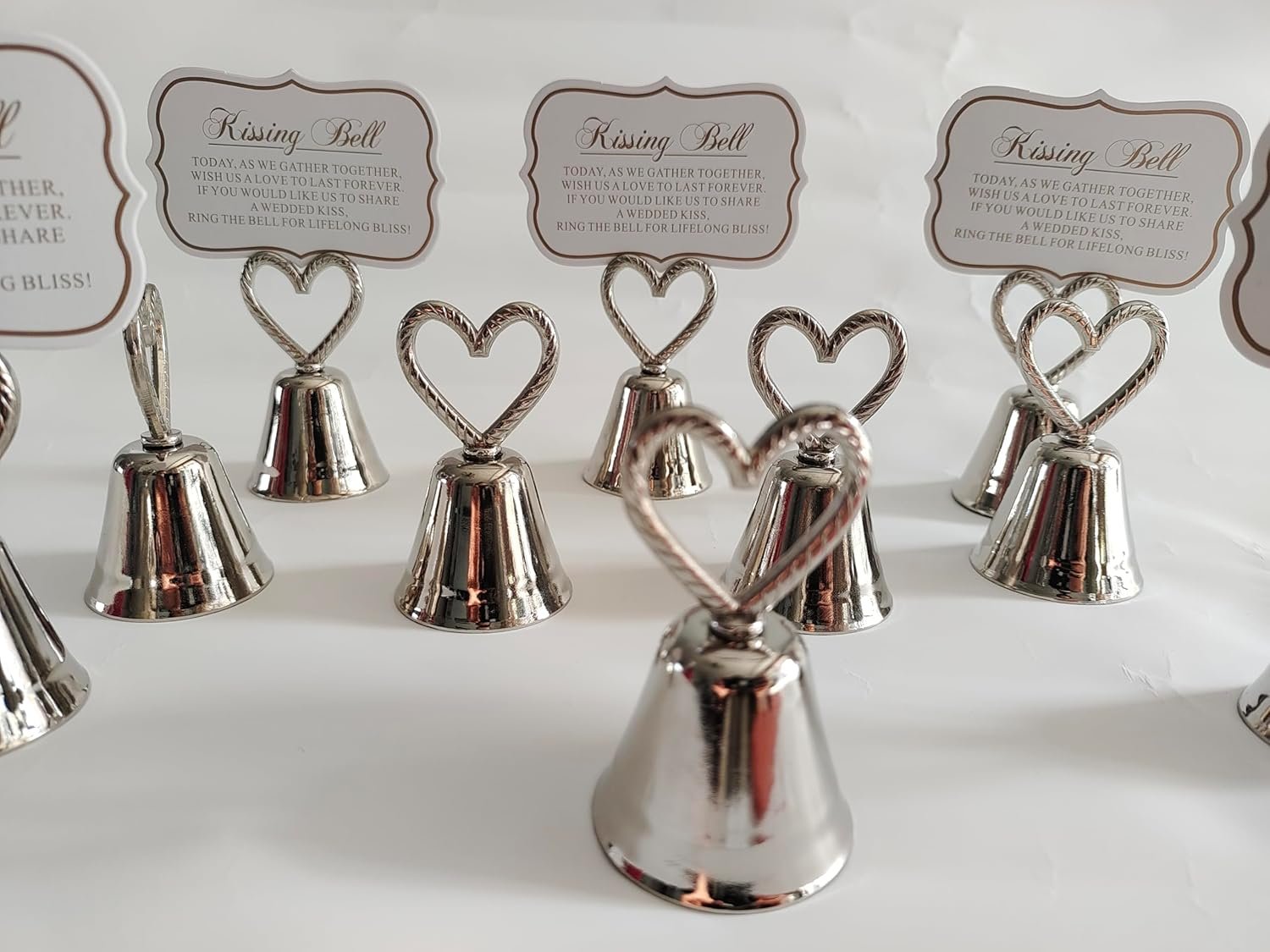 Wholesale 10Pcs Kissing Silver Bell Seat Table Card Place Number Photo Holders Party Favors Wedding Decorations Supplier